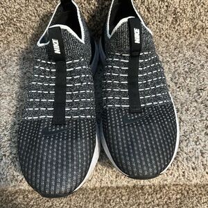 Nike women’s black and white slips on